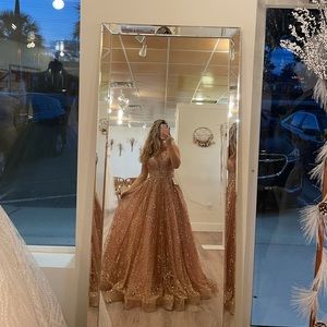 Beautiful gown from Camille’s of Wilmington, size 4, rose gold.